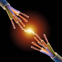 Close up of two exposed wires with current flowing between them